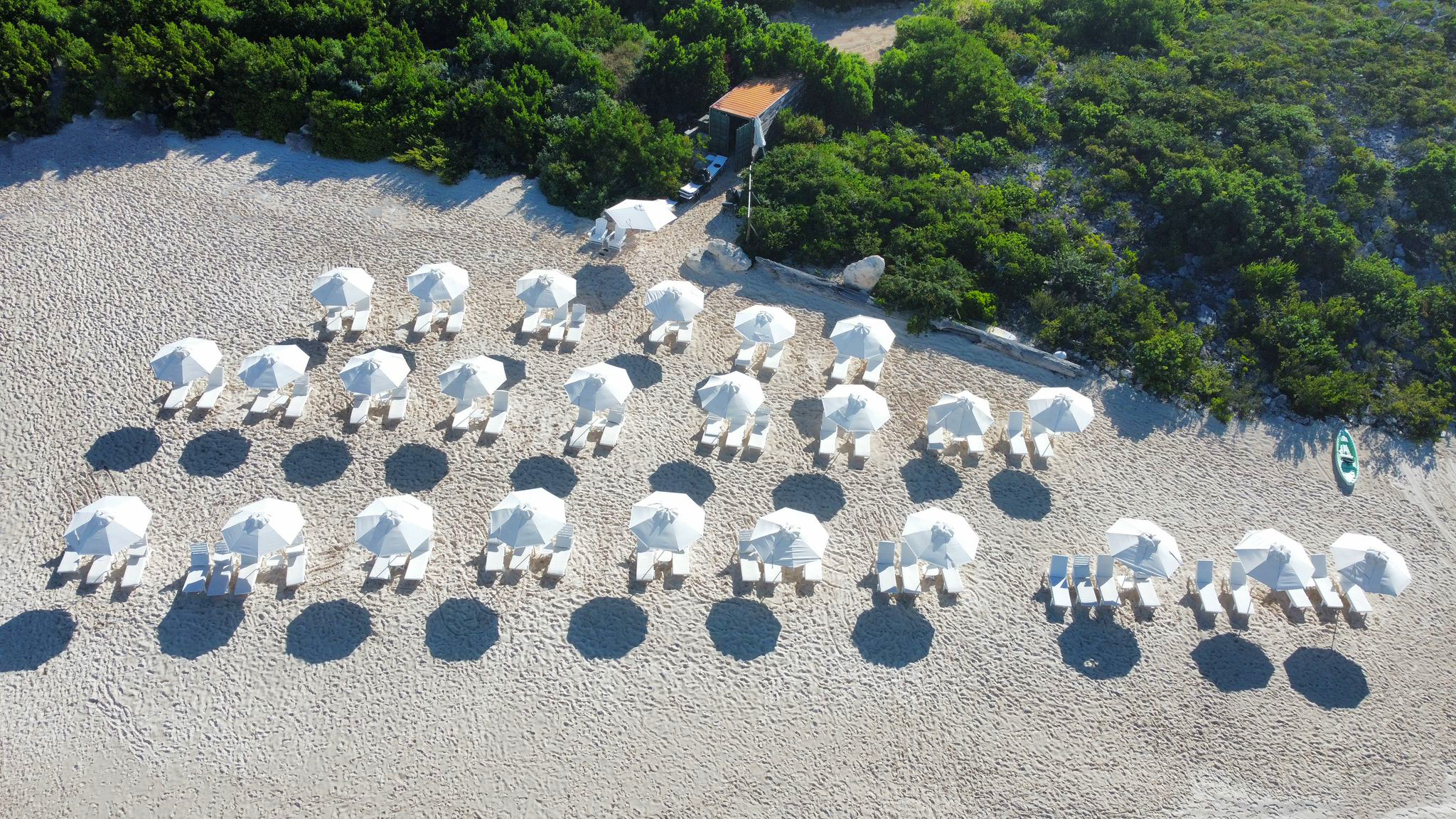 Frankford Beach Oakwood Loungers and umbrellas set up on the beach sand