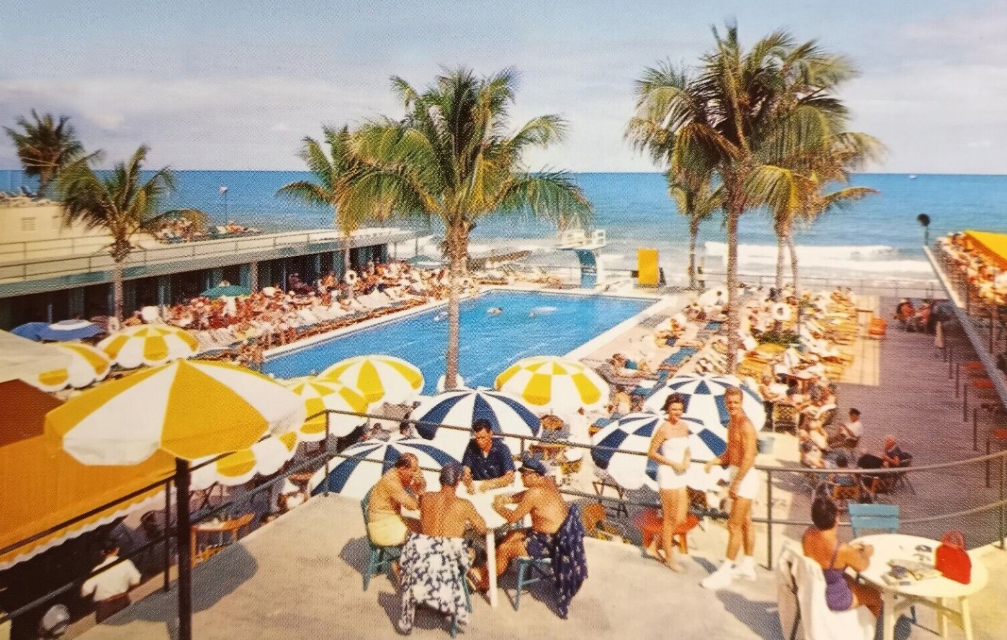 Beach club with pool and umbrellas
